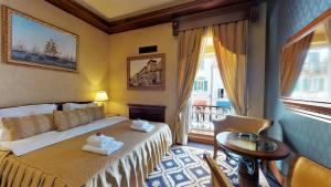 Voodi või voodid majutusasutuse Historic Boutique Hotel Cattaro toas