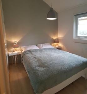Кровать или кровати в номере Chalet Descansar op de Veluwe