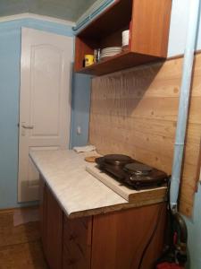 a kitchen with a counter top and a stove at улица Прохоровская 12 квартира in Odesa