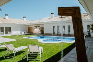 a view of the backyard of a house with a swimming pool at Casa Boquera in Carche
