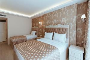 A bed or beds in a room at Istanroom by Keo