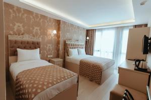A bed or beds in a room at Istanroom by Keo