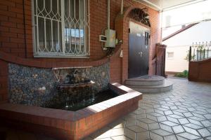 a bathroom with a fountain in the middle of a building at Don-Antonio in Krasnodar