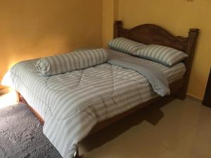 A bed or beds in a room at CM HOMESTAY