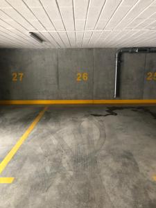 an empty parking garage with numbers on the wall at Bella Casa Premium Apartment - 104 Kobierzynska in Krakow