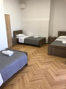 Postel nebo postele na pokoji v ubytování Guest House Chiko