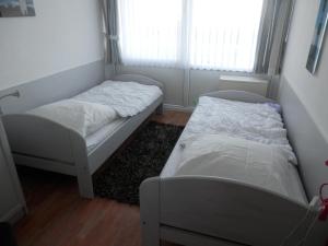 En eller flere senge i et værelse på Ostseeblick Heiligenhafen
