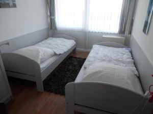 Postel nebo postele na pokoji v ubytování Ostseeblick Heiligenhafen