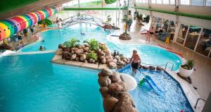 an overhead view of a pool at a water park at Hvide Sande Beach Apartments in Hvide Sande