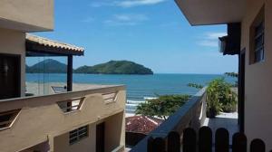 a view of the ocean from a balcony of a building at Edifício San Rafael in Ubatuba