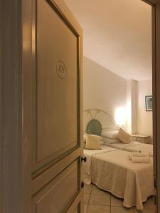 Łóżko lub łóżka w pokoju w obiekcie Hotel Sorgente