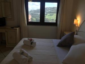 Łóżko lub łóżka w pokoju w obiekcie Hotel Sorgente