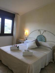 Łóżko lub łóżka w pokoju w obiekcie Hotel Sorgente