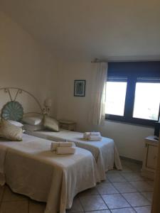 Łóżko lub łóżka w pokoju w obiekcie Hotel Sorgente