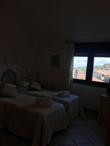 Łóżko lub łóżka w pokoju w obiekcie Hotel Sorgente