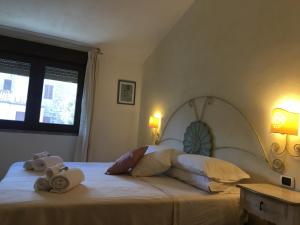 Łóżko lub łóżka w pokoju w obiekcie Hotel Sorgente