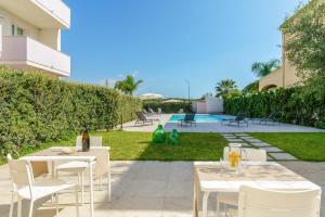 Vonkajšia záhrada v ubytovaní Travini Hotel Residence