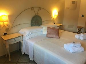 Łóżko lub łóżka w pokoju w obiekcie Hotel Sorgente