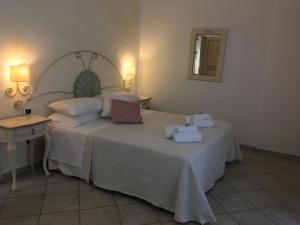 Łóżko lub łóżka w pokoju w obiekcie Hotel Sorgente