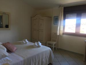 Łóżko lub łóżka w pokoju w obiekcie Hotel Sorgente