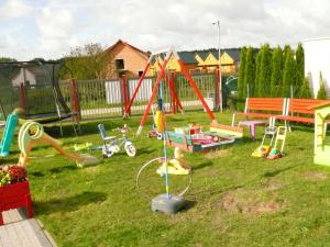 a bunch of playground equipment in a yard at Willa Natenczas in Jarosławiec