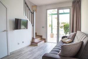 TV a/nebo společenská místnost v ubytování Complejo Sun's Gardens - Maspalomas
