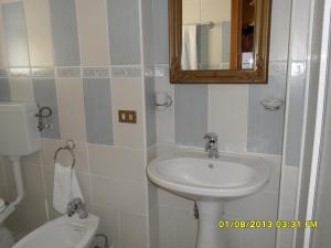 a bathroom with a sink and a toilet and a mirror at Bed & Breakfast Garrupa in Marcellinara +81 photos