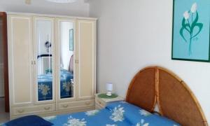 a bedroom with a bed and a cabinet at Casa in SALENTO a Otranto in Otranto