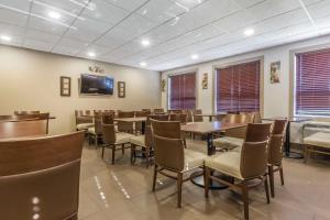 a dining room filled with tables and chairs at Comfort Inn & Suites Medicine Hat in Medicine Hat