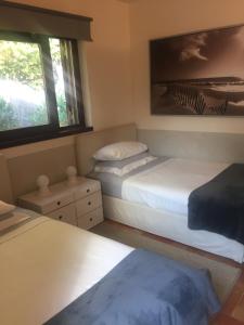 Postel nebo postele na pokoji v ubytování La casa nella Macchia