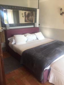 Postel nebo postele na pokoji v ubytování La casa nella Macchia