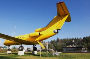 a yellow airplane is on display in a field at Yellow Plane in Yurov