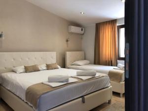 מיטה או מיטות בחדר ב-Days Inn Apartments