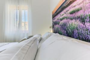 Postel nebo postele na pokoji v ubytování St.Lucija