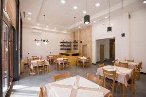 a restaurant with tables and chairs and a dining room at AnnaBella Boutique Hotel in Yerevan +46 photos