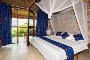 En eller flere senge i et værelse på Safari Beach Lodge