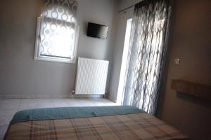 Posteľ alebo postele v izbe v ubytovaní Blue Dream Hotel