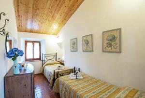 Postel nebo postele na pokoji v ubytování Agriturismo Il Poderuccio