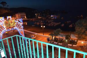 a view of a city at night with christmas lights at Maridea - Appartamenti Via Dante in Ponza