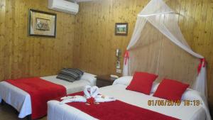 Łóżko lub łóżka w pokoju w obiekcie Hotel Playa Samil Vigo