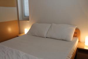 Postel nebo postele na pokoji v ubytování Apartment Zoranica Novalja