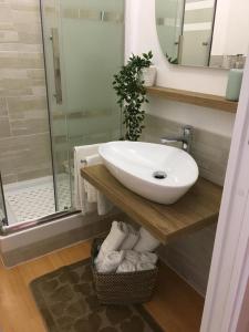 a bathroom with a white sink and a shower at La Fenice in Salerno