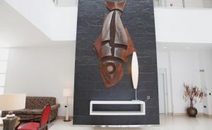 a living room with a painting on the wall at Hotel Adiafa in Barbate