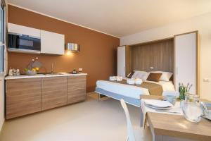 Kuchyňa alebo kuchynka v ubytovaní Travini Hotel Residence