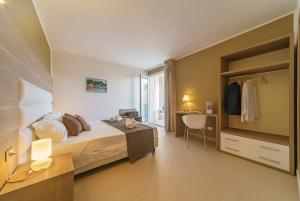 Posteľ alebo postele v izbe v ubytovaní Travini Hotel Residence