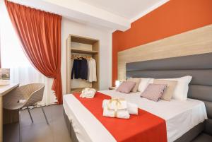 Posteľ alebo postele v izbe v ubytovaní Travini Hotel Residence