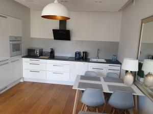 Η κουζίνα ή μικρή κουζίνα στο Apartament Starowiejska +12 φωτογραφίες