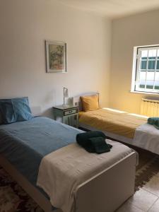 Postel nebo postele na pokoji v ubytování Casa Harmonica com vista mar