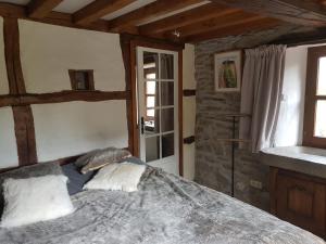Katil atau katil-katil dalam bilik di Ancien moulin de Vaux Chavanne