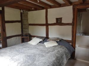 Katil atau katil-katil dalam bilik di Ancien moulin de Vaux Chavanne